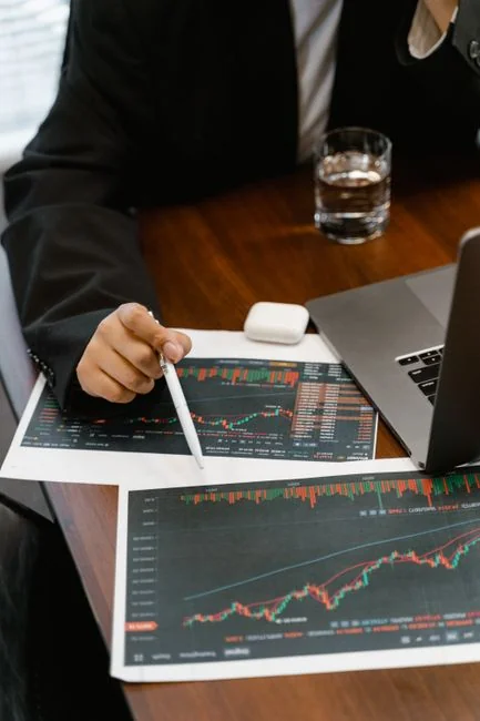 Close-up of hands typing on a laptop displaying a content plan document, ideal for business or marketing content.